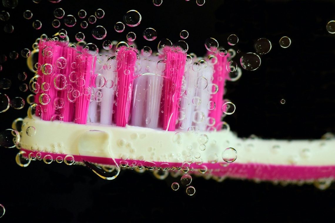 Cleaning a toothbrush